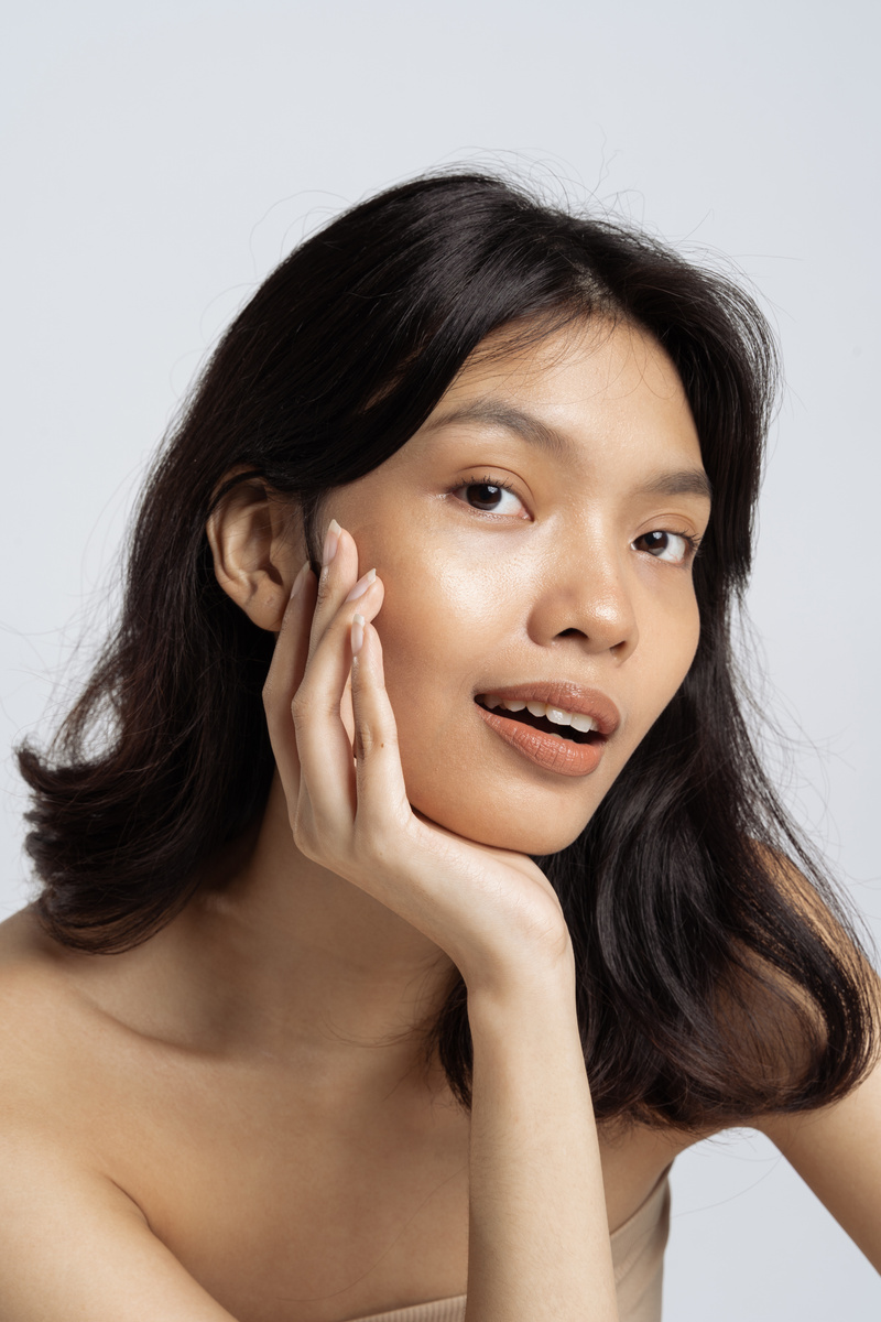Portrait of a Woman Touching Her Face